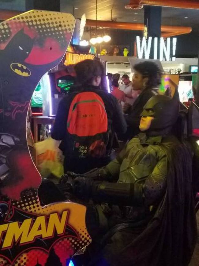 batman playing batman arcade game, costume