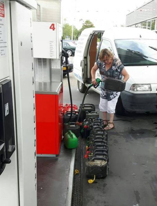 when you need all the gas, lady filling 18 containers of gasoline