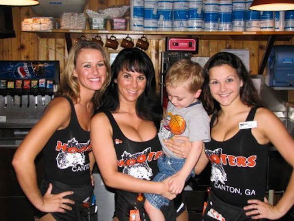 kid knows what it means to go eat at hooters, staring at boobs