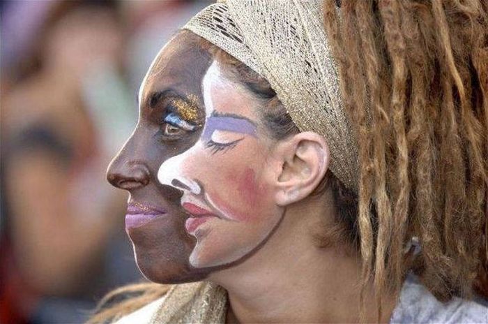 white face on black face on white woman