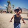 kid reacting to giant dinosaur