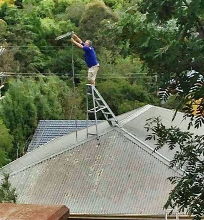 worst antenna repair man ever, ladder on roof, unsafe work conditions