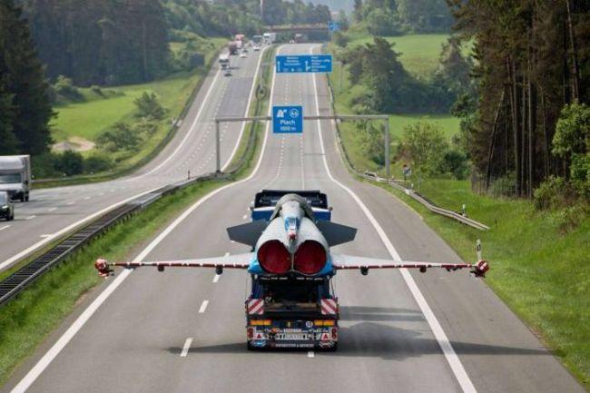 when you're stuck behind a slow driver but don't dare pass, fighter jet on truck on the highway