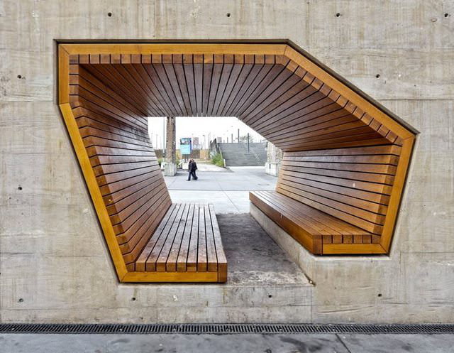 bench through concrete wall, cool architecture