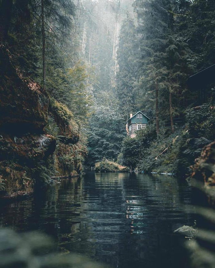 just a little house in the woods by a river, beautiful scenery
