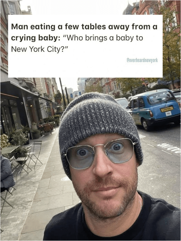 man eating a few tables away from a crying baby, who brings a baby to new york city?