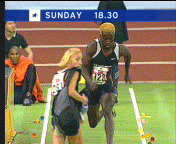 inattentive track and field woman wanders onto live track and gets run over, ouch, fail
