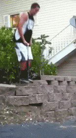 guy on pogo stick falls back first onto some large drive way bricks, fail, ouch