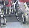 woman tries to go up escalator in a wheelchair and fails hard, ouch