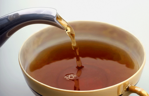 pouring tea into a tea cup, perfectly looped gif