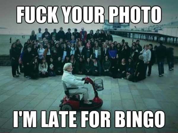 fuck your photo, i'm late for bingo, meme, old man on scooter photobombs crowd photo