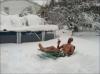 snow, lawn chair, swimming trunks, wtf