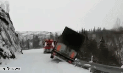 truck falls off cliff and takes tow truck with it, driver barely escapes