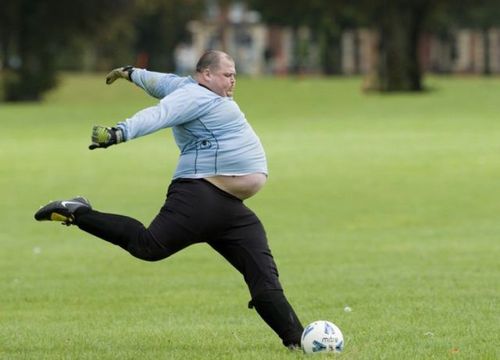 fat guy about to kick a soccer ball, timing