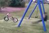 kid does back flip off swing onto a bicycle, win