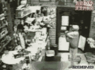 worst robbery attempt ever, robber throws his guns at the cashier and runs away