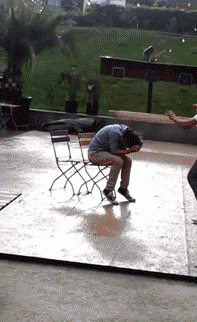 guy leap frogs friend on chair and fails hard, face plant, ouch