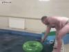 fat guy breaks physics by diving through small inner tube
