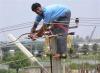 power lines, telephone wire, indian man, unsafe work conditions