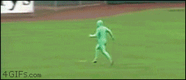 man wearing green jump suit leads chase on baseball field, lol, troll
