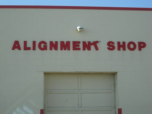 ironic sign, alignment shop, fail