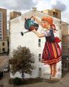 street art, side of building, win, little girl watering tree