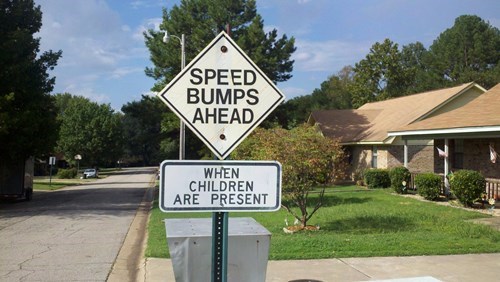 sign, wtf, speed bumps ahead when children are at play