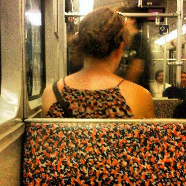 poorly dressed, matching the subway seat