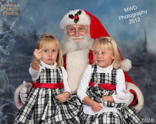 awkward family photos, little girl gives the finger, santa claus, christmas