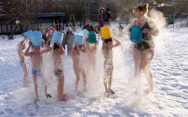 kids pouring hot water over themselves in the winter, steam