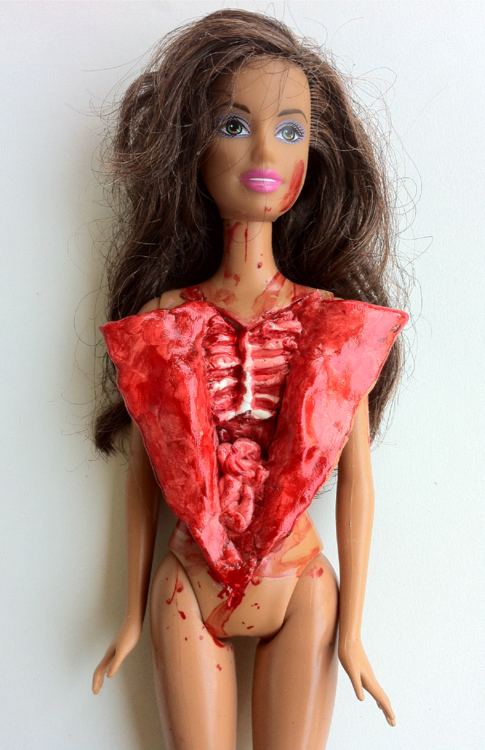 bloody barbie's rib cage exposed, wtf, doll