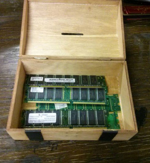 wooden box with ram sticks in it