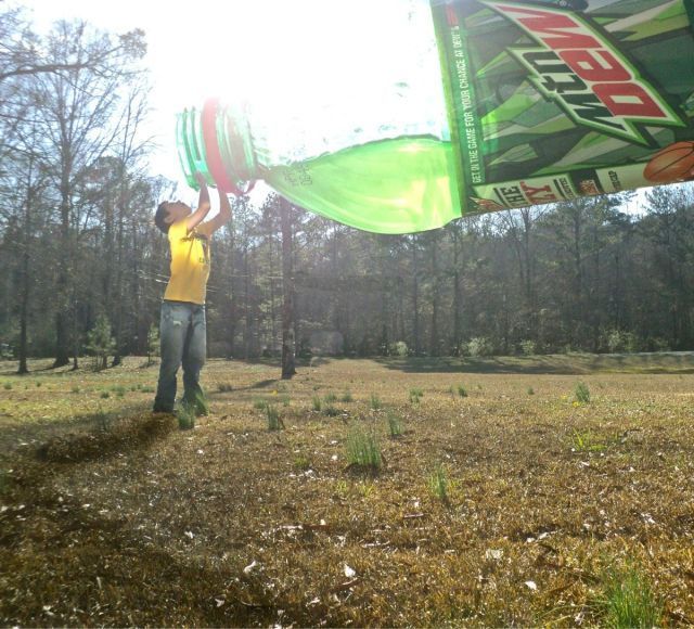 perspective, guy drinks giant mountain dew
