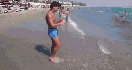 a glitch in the matrix, guys does too many back flips really fast on beach, gif