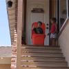 kid pushes sibling down the stairs in a big plastic container, lol, fake