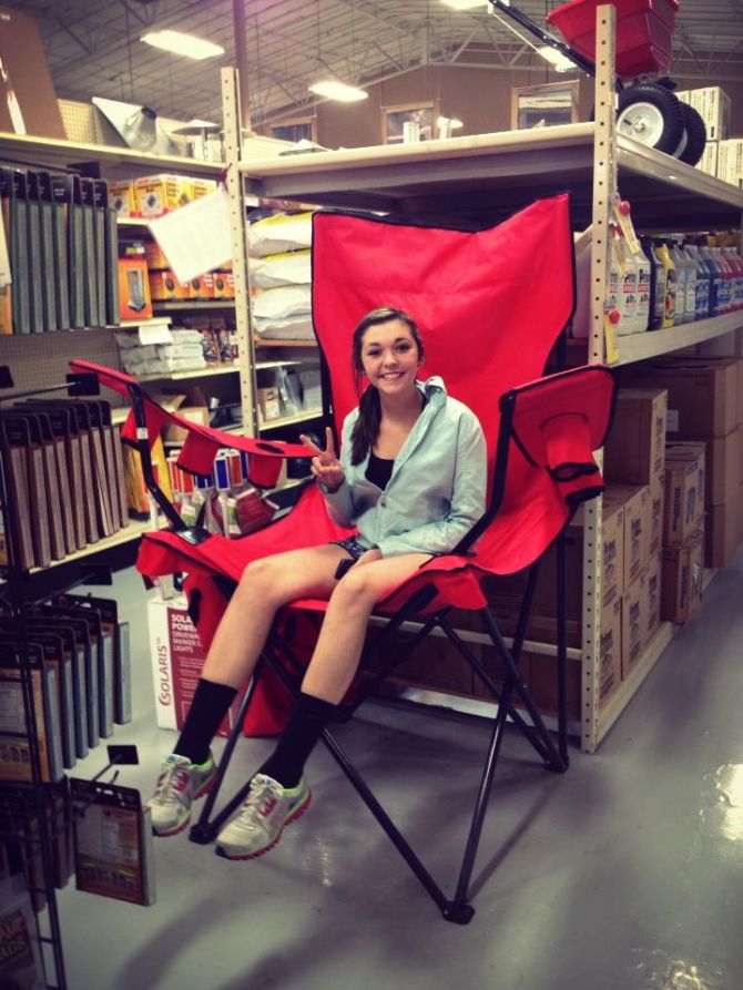 girl sitting in a giant camping chair
