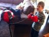 that's one way to get your kid of get his own tooth out, boxing gloves