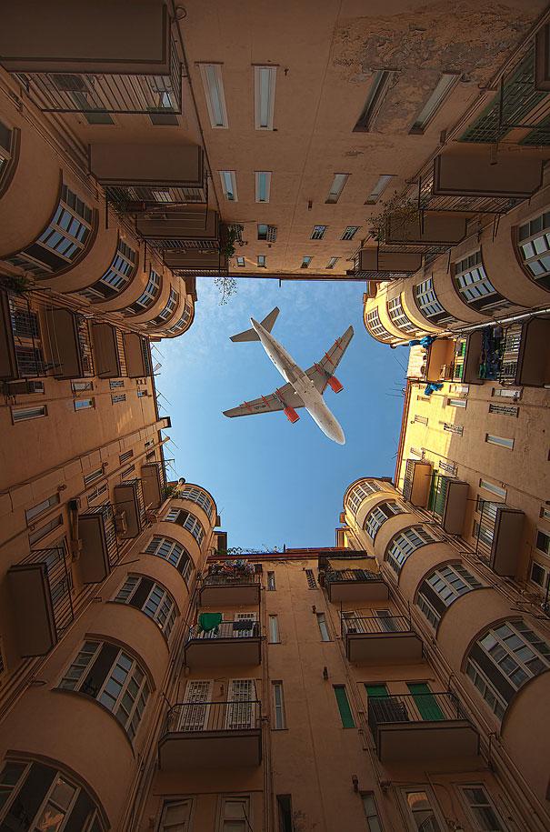 perfectly timed photos, plane passing over court yard, photography