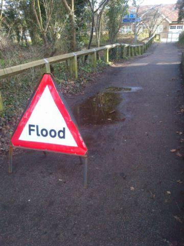exaggerated sign, flood, puddle