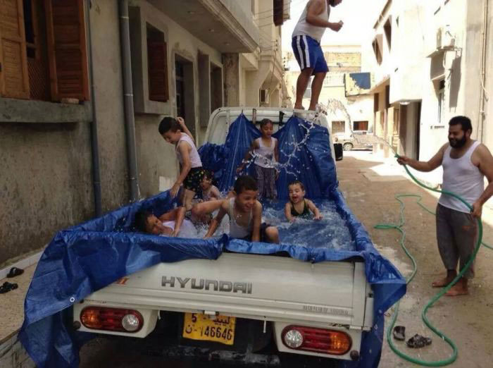 who said you need money to be happy, make shift pool in the back of a pick up truck