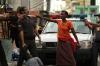 the most raw photo of the week, haitian woman protecting her son with a knife the a cop's throat