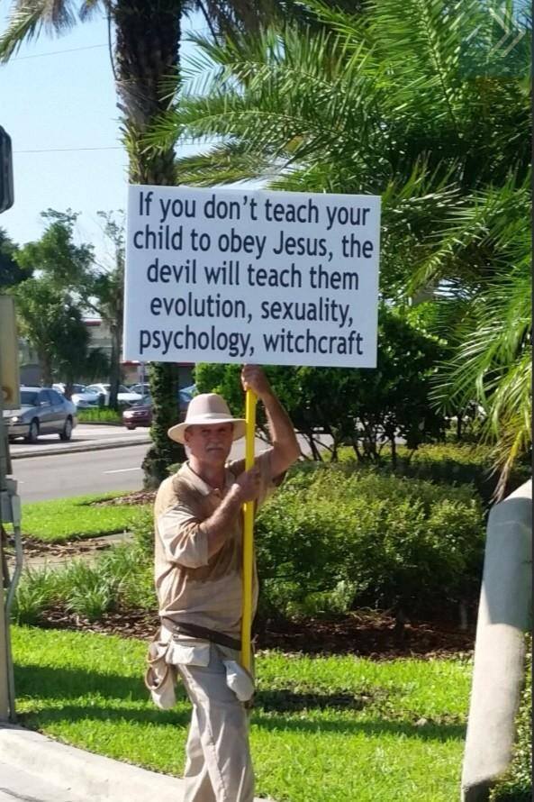 if you do not teach your child to obey jesus the devil will teach them evolution sexuality psychology and witchcraft, religious protester sign