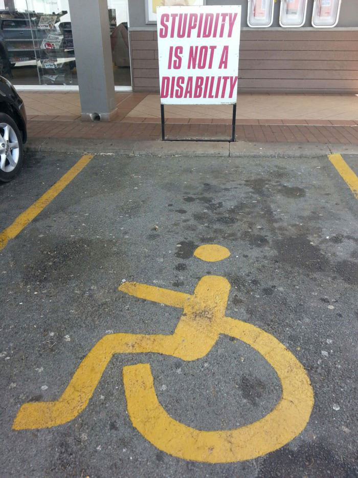 stupidity is not a disability, parking space sign