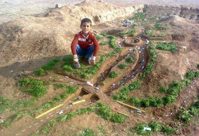 this kid is a future engineer, roads in the dirt