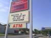 ironic sign is ironic, education is important but cold beer is importantner, gas station, lol, spelling