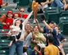 'murica, mother catches baseball while holding baby in other hand