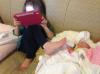 when kids help out around the house, daughter holding baby bottle with her foot while on a tablet, cute kids