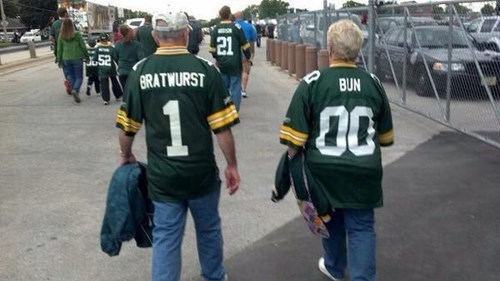 old couple with very sexual jerseys, bratwurst and bun