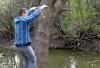 boy tries to rope swing across is stream but it breaks and he lands right in the middle, fail