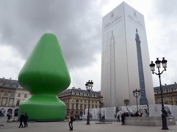 giant inflatable sex toy in paris supposed to be a christmas tree
